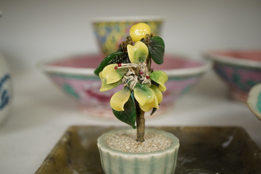 Three Chinese dishes, a famille rose stem cup, two hardstone threes and a soapstone dish